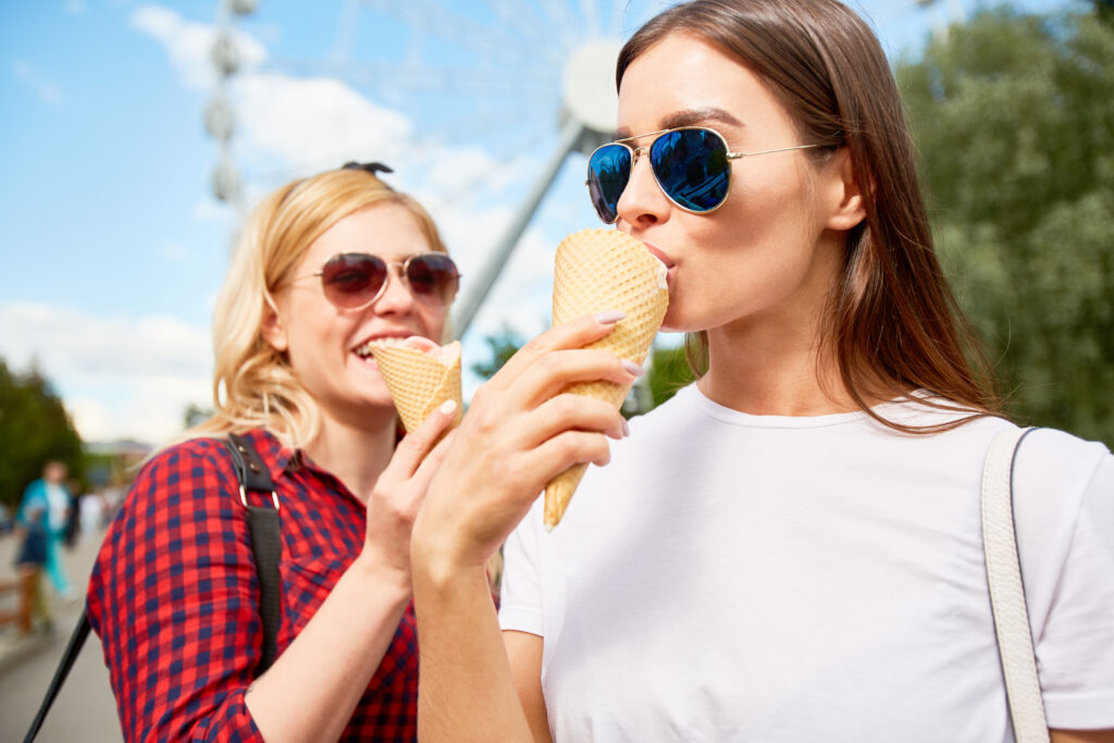 Woman enjoying ice cream - impulse purchase or real need?